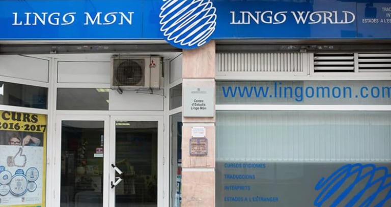 Storefront of Lingo Mon language school with blue and white signage and website URL displayed on glass windows