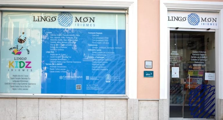 Exterior of Lingo Mon language school storefront with blue signage and glass entrance door