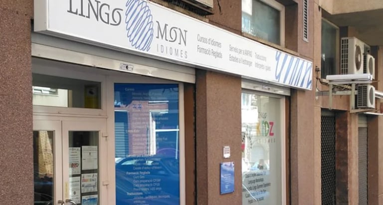 Storefront with Lings Mon signage, blue entrance door, and display windows on a brick building facade